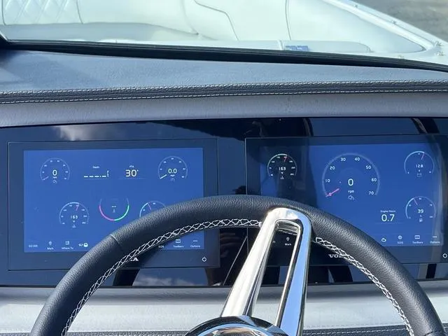 Slide: The Image of 2025 Regal LS4 dashboard with digital displays and steering wheel. - 12