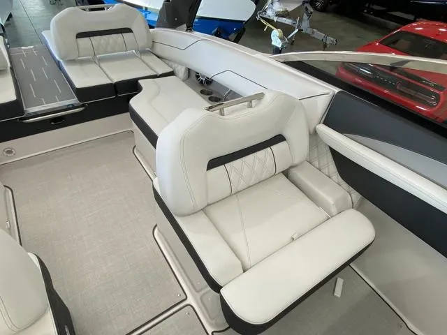 Slide: The Image of 2025 Regal LS4 boat interior with luxurious white seating and modern design. - 17