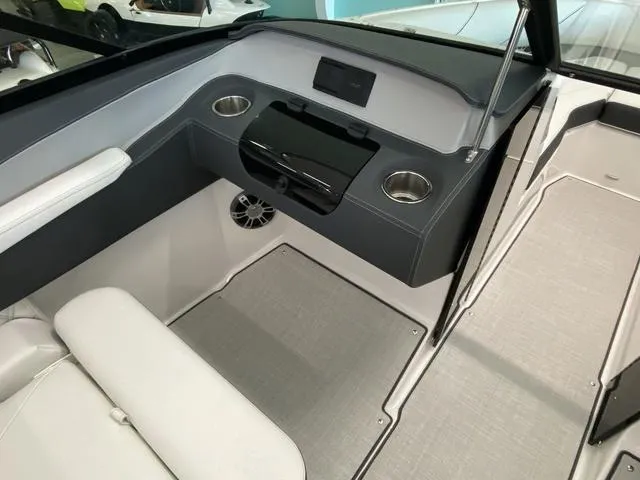 Slide: The Image of Interior of 2025 Regal LS4 boat with modern dashboard and seating. - 18