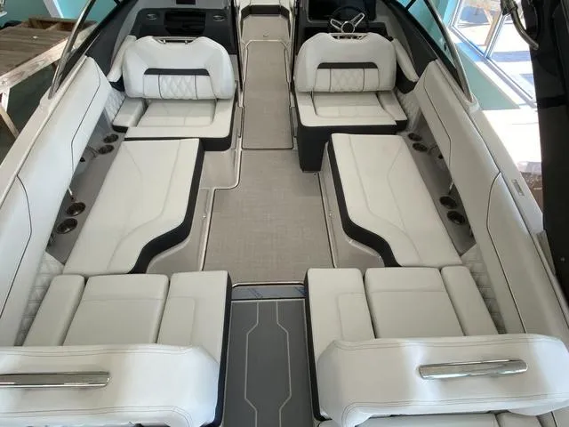 Slide: The Image of Luxurious interior of 2025 Regal LS4 boat with spacious white seating. - 19
