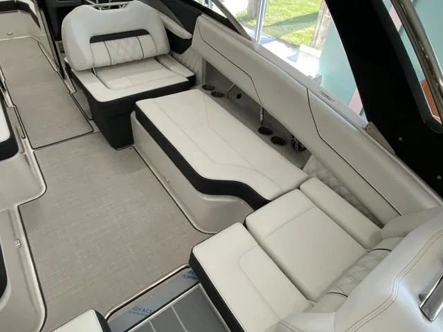 Slide: The Image of Luxurious interior of 2025 Regal LS4 boat with white leather seating. - 22