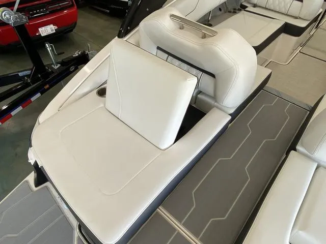 Slide: The Image of 2025 Regal LS4 boat interior with white leather seating and modern design. - 26
