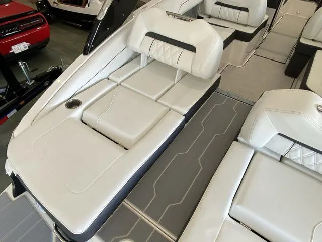 Slide: The Image of 2025 Regal LS4 boat interior with luxurious white seating and modern design. - 27