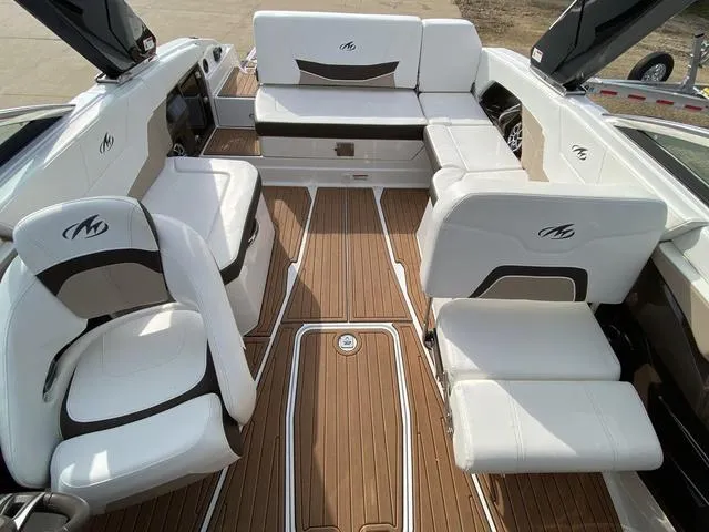 Slide: The Image of Luxurious 2017 Monterey 278SS boat interior with white seating and teak flooring. - 10