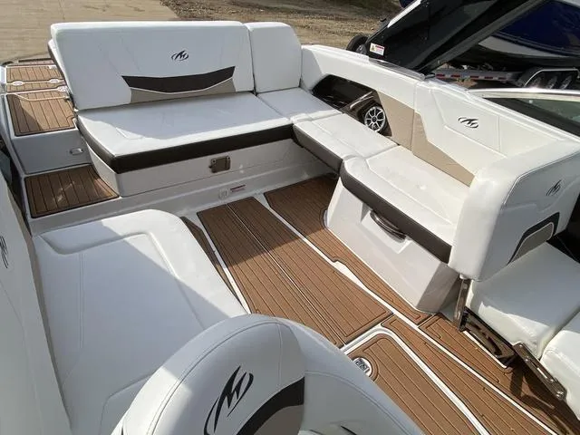 Slide: The Image of 2017 Monterey 278SS boat interior with white seating and teak flooring. - 12