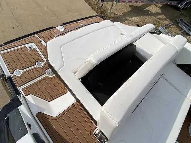 Slide: The Image of 2017 Monterey 278SS boat with white seating and brown deck accents. - 16