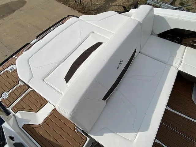 Slide: The Image of 2017 Monterey 278SS boat with white cushioned seating and teak-style flooring. - 17