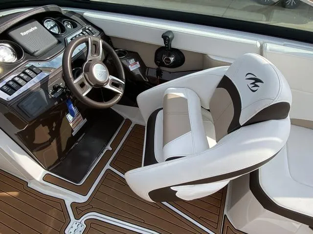 Slide: The Image of 2017 Monterey 278SS boat interior with steering wheel and captain's chair. - 21