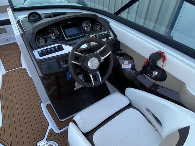 Slide: The Image of 2017 Monterey 278SS boat cockpit with modern dashboard and steering wheel. - 22