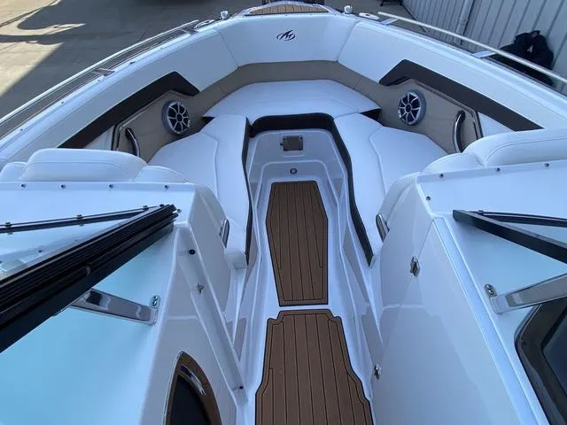 Slide: The Image of 2017 Monterey 278SS boat interior with sleek seating and wood accents. - 27
