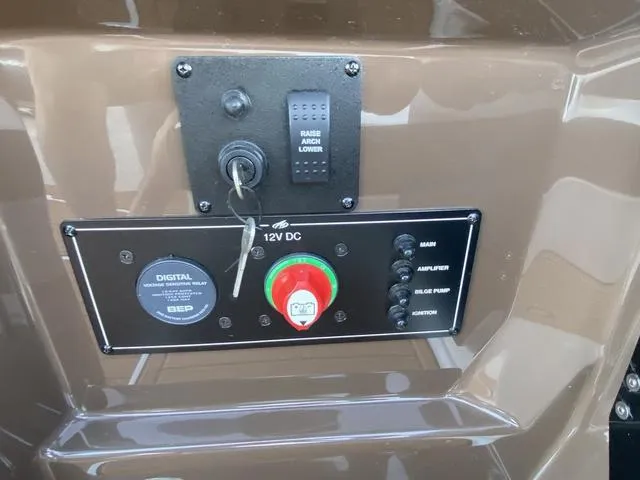 Slide: The Image of Control panel of a 2017 Monterey 278SS boat with ignition and switches. - 32