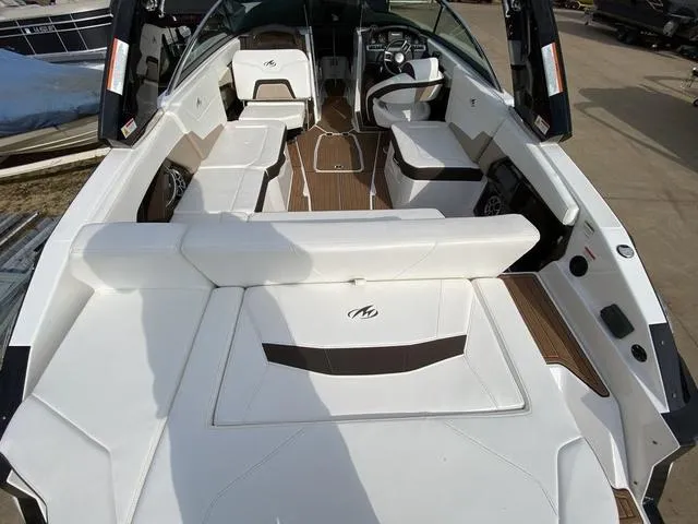 Slide: The Image of 2017 Monterey 278SS boat interior with white seating and wood accents. - 6