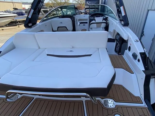 Slide: The Image of 2017 Monterey 278SS boat with white seating and teak flooring, docked outdoors. - 7