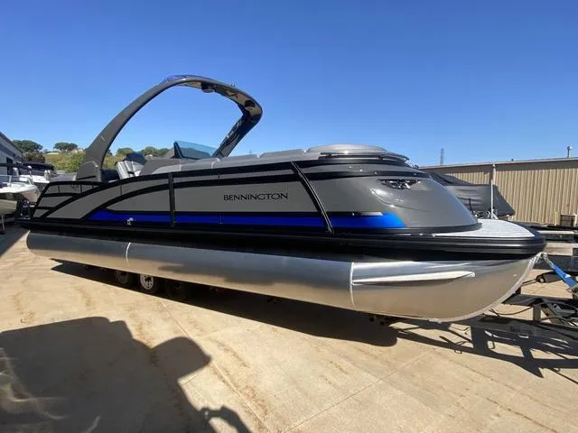Slide: The Image of 2025 Bennington 25 QFBA pontoon boat with sleek design and modern features. - 1