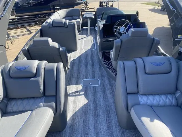 Slide: The Image of Luxurious interior of 2025 Bennington 25 QFBA pontoon boat with plush seating and modern design. - 11