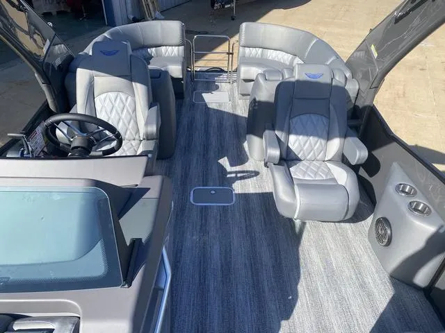 Slide: The Image of 2025 Bennington 25 QFBA boat interior with luxurious gray seating and modern design. - 12