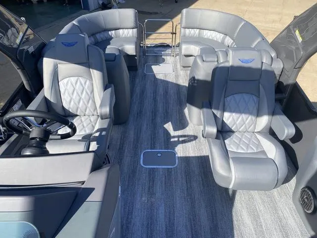 Slide: The Image of 2025 Bennington 25 QFBA boat interior with luxurious gray seating and modern design. - 13