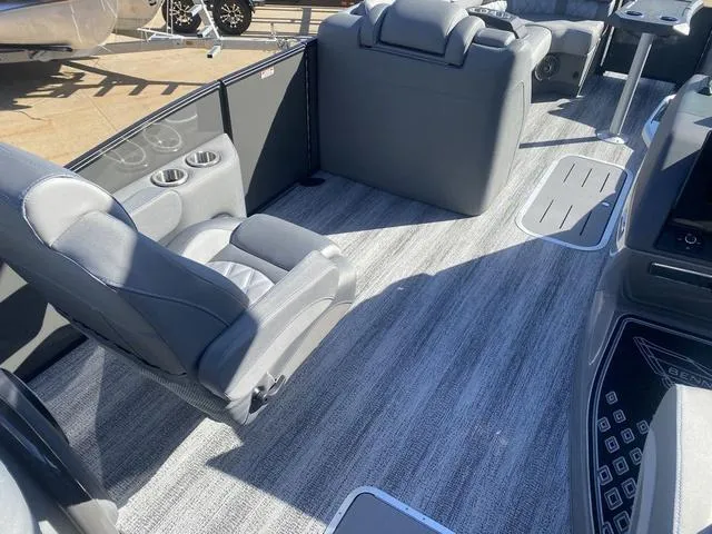 Slide: The Image of 2025 Bennington 25 QFBA boat interior with gray seating and flooring. - 20