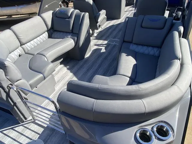 Slide: The Image of Luxurious seating on 2025 Bennington 25 QFBA pontoon boat with modern gray upholstery. - 22