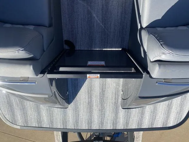 Slide: The Image of 2025 Bennington 25 QFBA boat interior with gray seating and sleek design. - 26