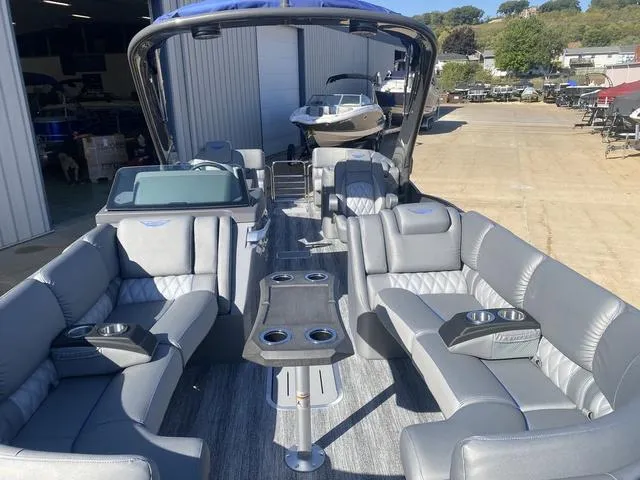 Slide: The Image of 2025 Bennington 25 QFBA pontoon boat with luxurious seating and modern design. - 8
