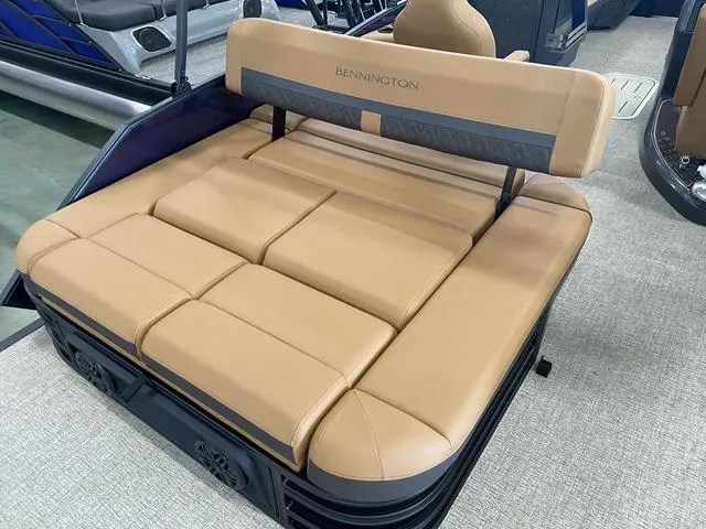 Slide: The Image of 2025 Bennington 24' MSB Tri-Toon boat with tan cushioned seating. - 12