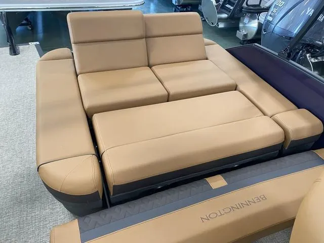 Slide: The Image of Luxurious seating on 2025 Bennington 24' MSB Tri-Toon boat, featuring tan upholstery. - 15