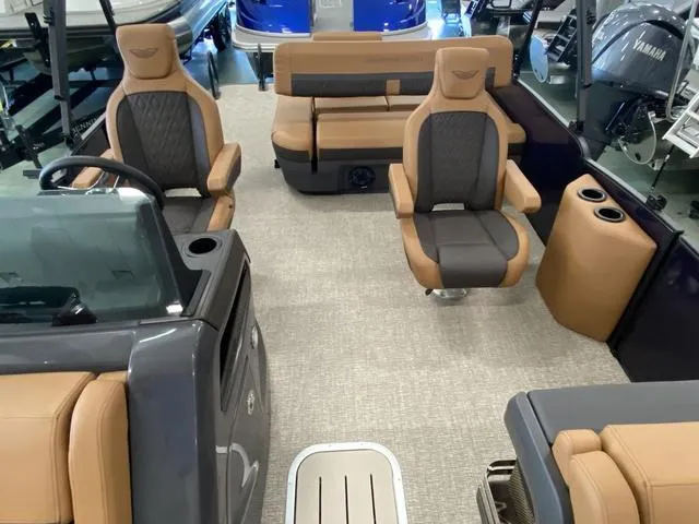 Slide: The Image of 2025 Bennington 24' MSB Tri-Toon interior with luxurious seating and modern design. - 19