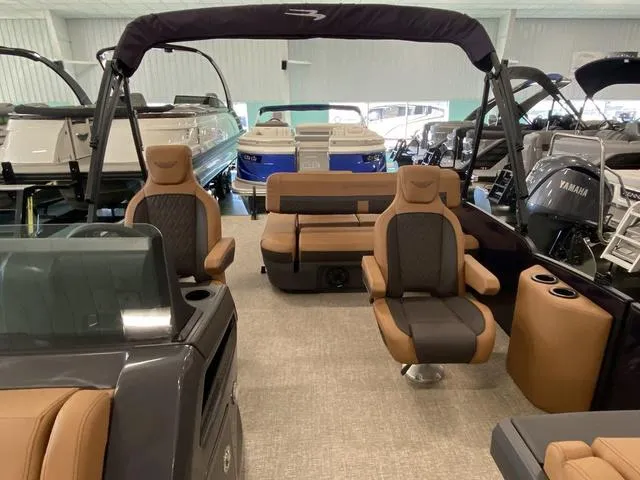 Slide: The Image of 2025 Bennington 24' MSB Tri-Toon boat interior with luxurious seating and modern design. - 20