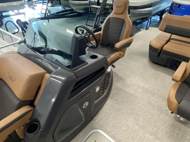 Slide: The Image of 2025 Bennington 24' MSB Tri-Toon boat interior with modern helm and seating. - 21