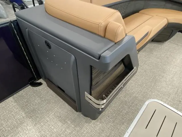 Slide: The Image of 2025 Bennington 24' MSB Tri-Toon interior with tan seating and modern design. - 29