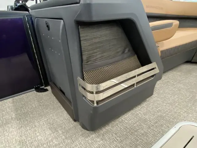 Slide: The Image of 2025 Bennington 24' MSB Tri-Toon interior detail with modern seating and storage. - 30