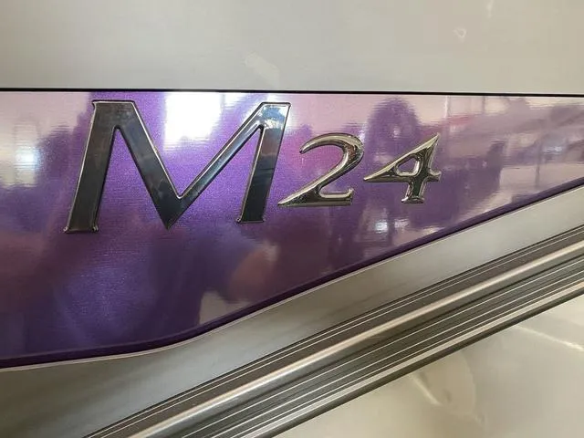 Slide: The Image of 2025 Bennington 24' MSB Tri-Toon, purple M24 logo detail. - 31