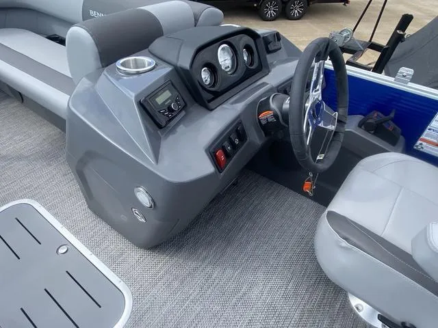 Slide: The Image of 2024 Bennington 20 SVSR-SPS boat interior with gray flooring and seating. - 11