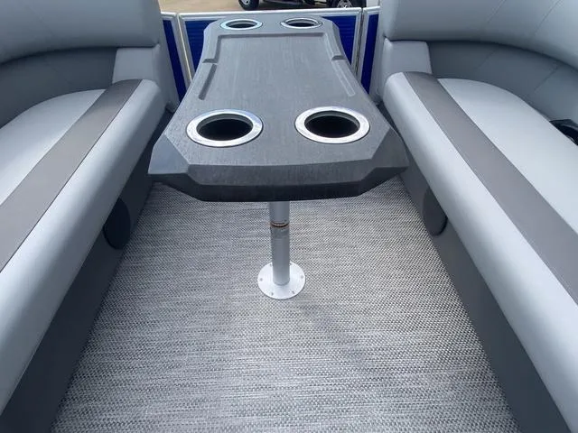 Slide: The Image of 2024 Bennington 20 SVSR-SPS pontoon boat interior with gray seating and cup holders. - 13