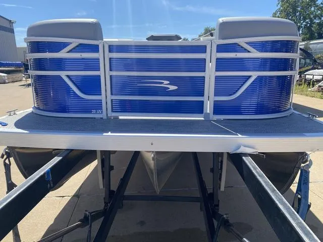 Slide: The Image of 2024 Bennington 20 SVSR-SPS pontoon boat interior with gray seating and steering console. - 4