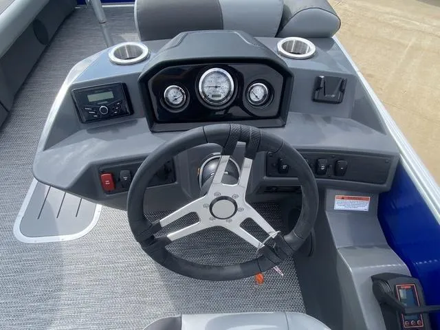 Slide: The Image of 2024 Bennington 20 SVSR-SPS boat dashboard with steering wheel and gauges. - 6