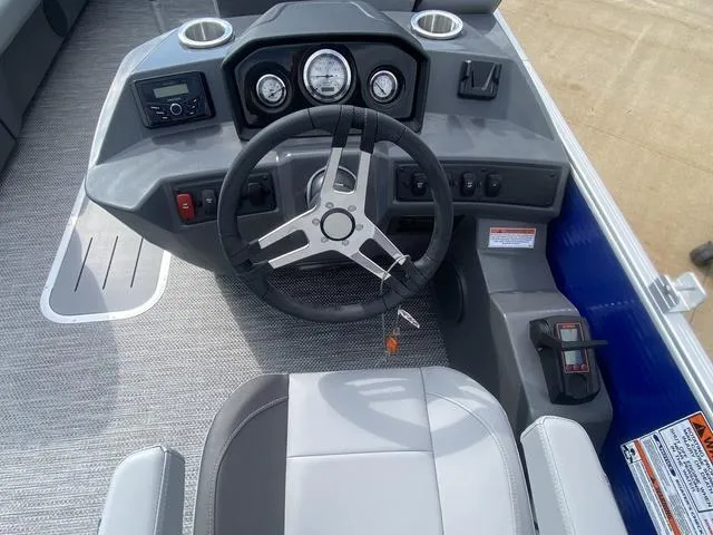 Slide: The Image of 2024 Bennington 20 SVSR-SPS pontoon boat interior with gray seating and table. - 7