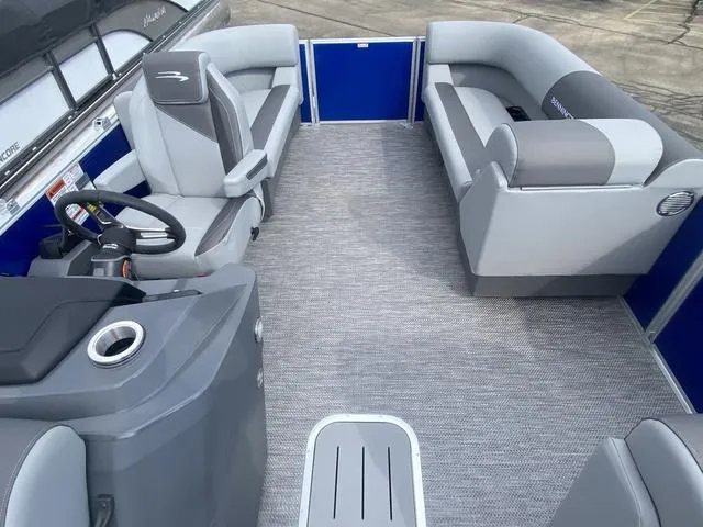 Slide: The Image of 2024 Bennington 20 SVSR-SPS pontoon boat interior with gray seating and blue accents. - 9