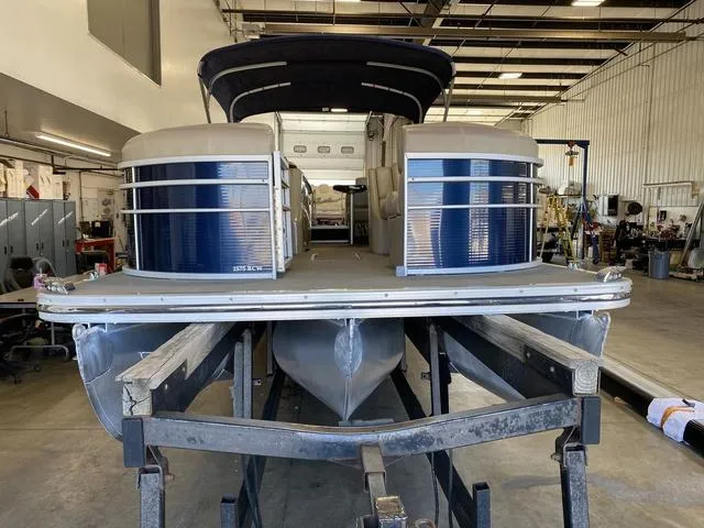 Slide: The Image of 2012 Bennington 25 RCW-I/O pontoon boat in a workshop setting. - 4