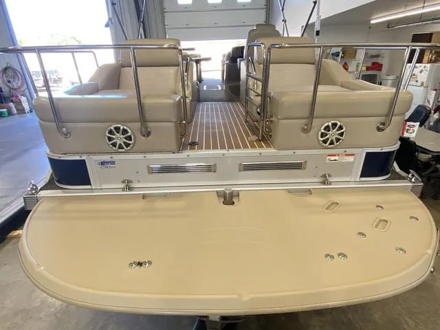 Slide: The Image of 2012 Bennington 25 RCW-I/O pontoon boat with spacious seating and modern design. - 7