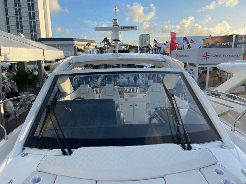 Slide: The Image of 2025 Jeanneau DB/43 OB luxury yacht at a boat show, showcasing sleek design and modern features. - 10