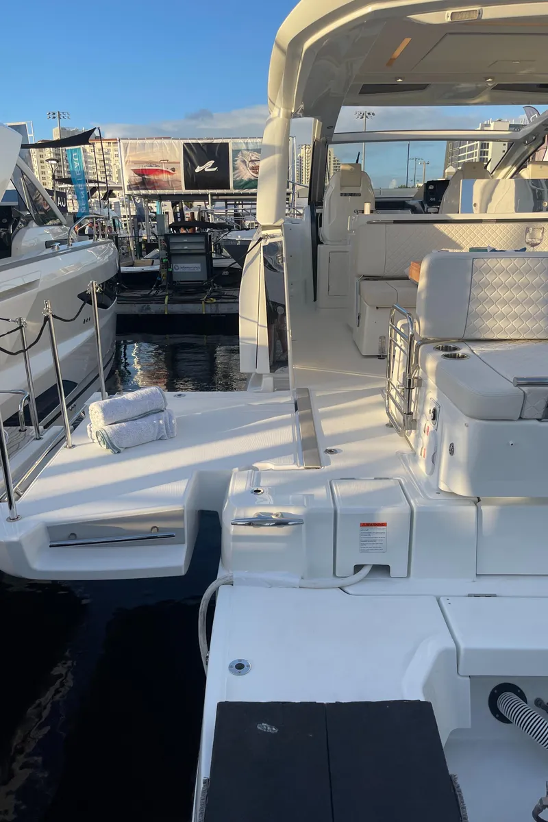 Slide: The Image of 2025 Jeanneau DB/43 OB luxury yacht docked at marina. - 13