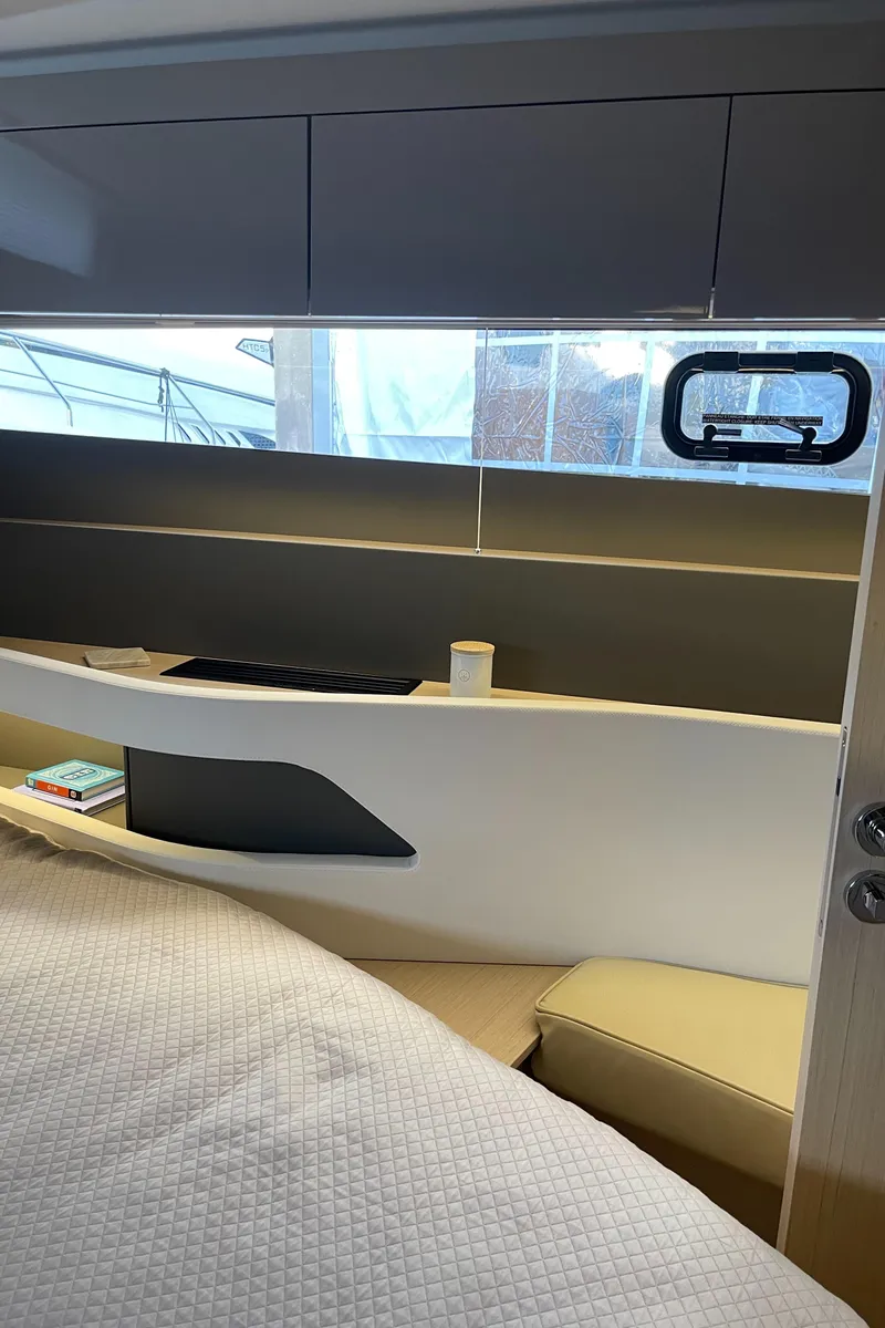 Slide: The Image of 2025 Jeanneau DB/43 OB cabin interior with modern design and cozy seating. - 19