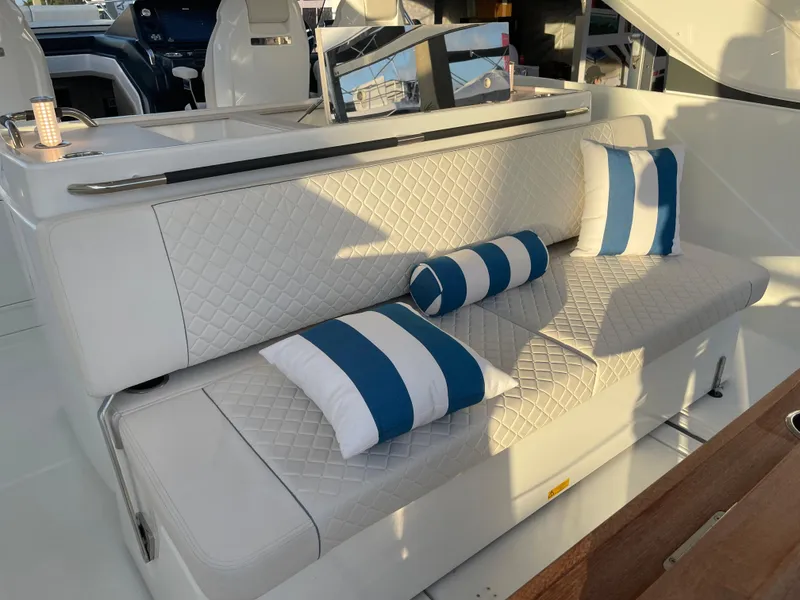 Slide: The Image of Luxurious seating on 2025 Jeanneau DB/43 OB with striped cushions. - 3
