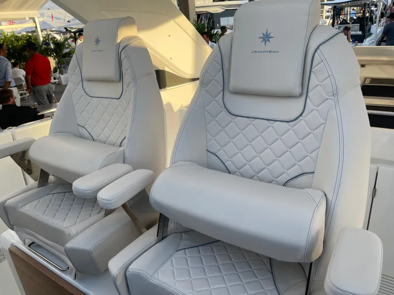 Slide: The Image of Luxurious white leather seats on 2025 Jeanneau DB/43 OB boat, featuring quilted design. - 6