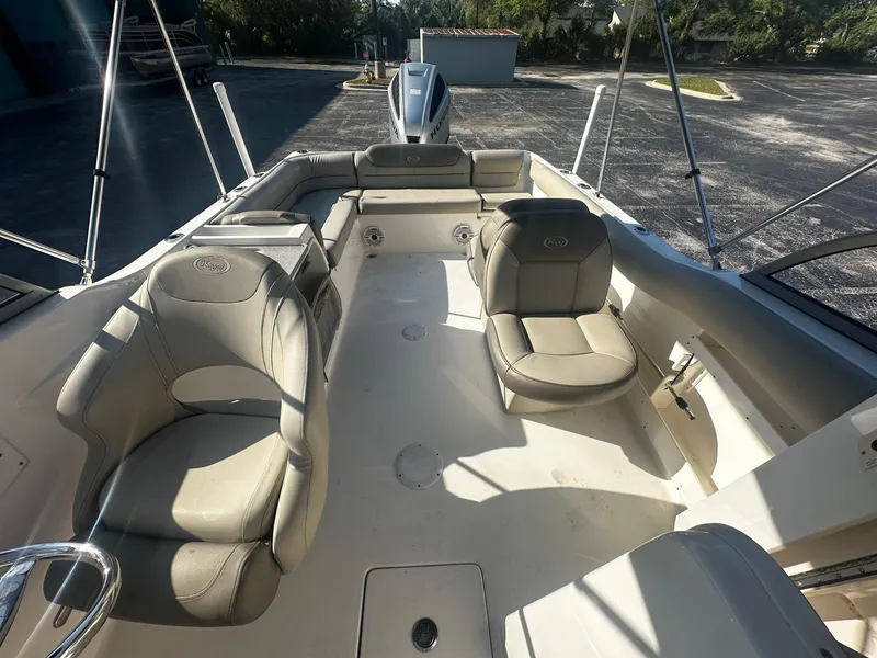 Slide: The Image of 2022 Key West 239 DFS boat interior with beige seating and spacious layout. - 5
