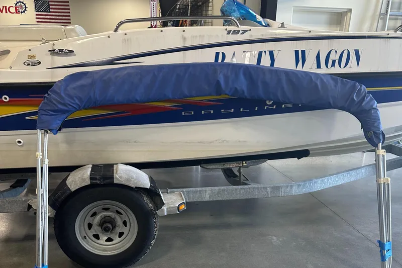 Slide: The Image of 2007 Bayliner 197 boat on trailer in showroom. - 12