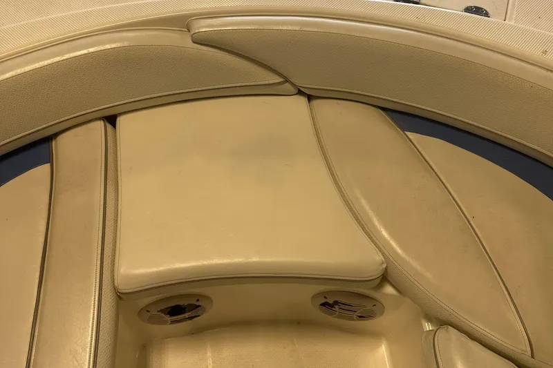 Slide: The Image of 2007 Bayliner 197 boat interior seating with beige upholstery. - 3