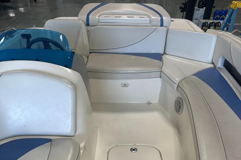 Slide: The Image of 2007 Bayliner 197 boat interior with white and blue seating. - 4